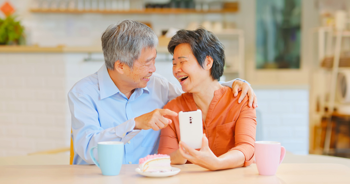 old couple use phone